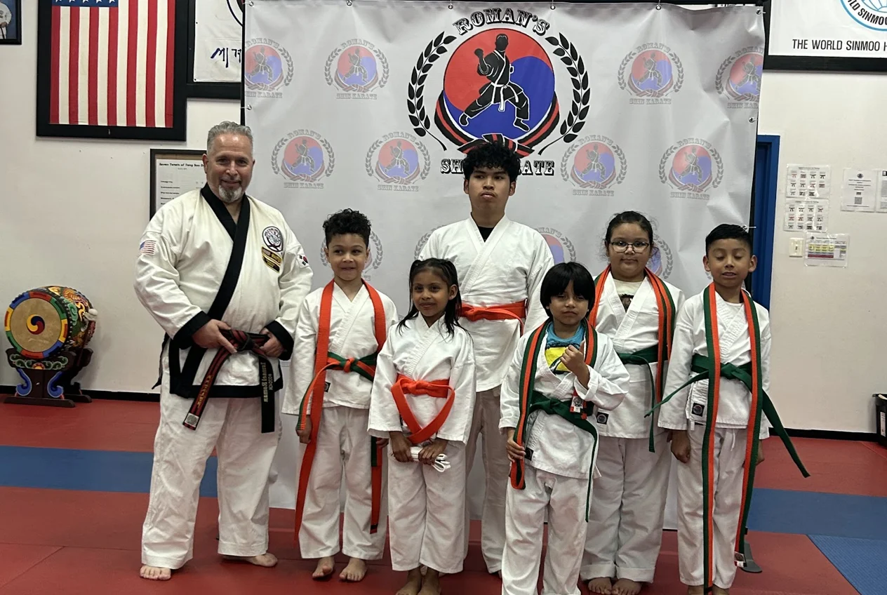 Students of all ages lined up together after class at Roman's Shin Karate in Hamilton